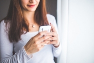 Image of woman looking at cellphone